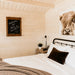 Harvest Grand Bungalow bedroom featuring a “welcome to the bunkie” chalkboard, Highland cow artwork and rustic bedside décor.