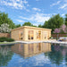 A serene garden view places the GardenHouse24 USA Henning 70 Garden Room beside a reflective pool with vibrant landscaping