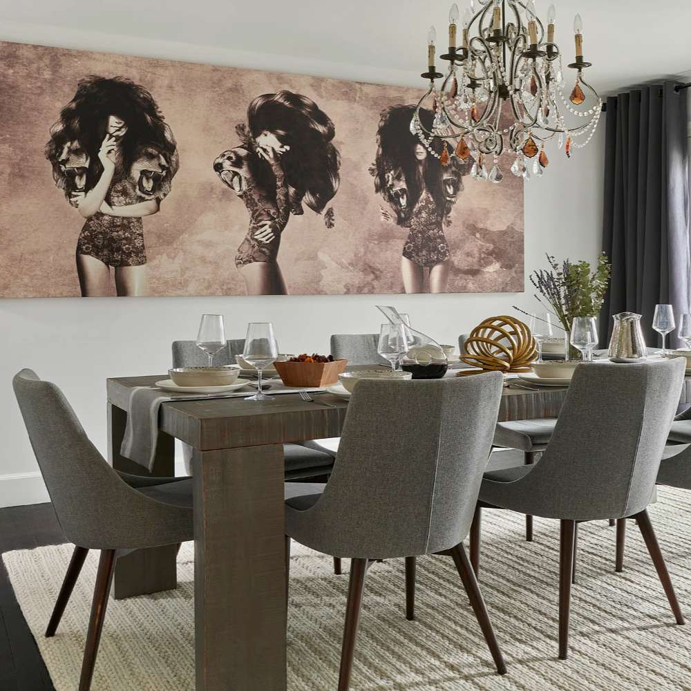 In a chic dining room, Momeni Andes Indoor Rug - AND-9 Ivory brings warmth and texture beneath a rustic wood table and modern chairs