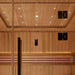 Inside Golden Designs Osla 6 Person Traditional Sauna, tiny star lights dot the cedar ceiling above a black door handle and softly lit backrest boards