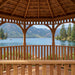 Interior view of Outdoor Living Today Western Red Cedar Octagon Bayside Gazebo overlooking a peaceful lake and mountain scenery