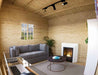 Interior of the Sawmill Structures Multi Cube Versa 100 Garden Room features a modern fireplace, a gray couch, and a large window