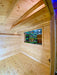 Interior view of the all-wooden Sawmill Structures The Lakeside Versa Cabana 67 Garden Room shows unfinished pine walls and ceiling beams