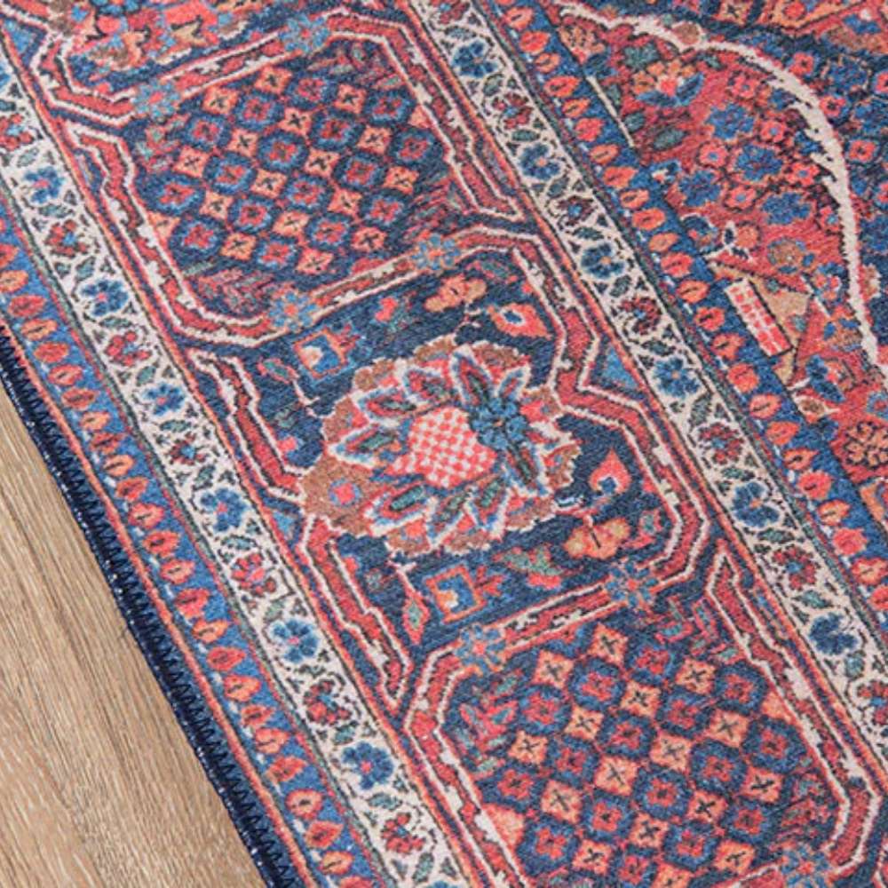Intricate border and floral patterns of Momeni Afshar Indoor Rug - AFS10 Navy featuring deep navy and red tones with fine detailing