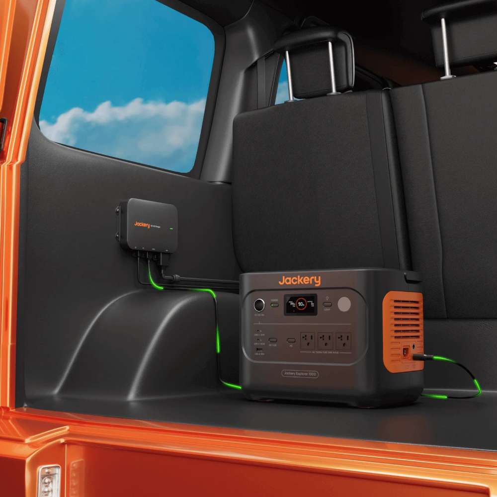 Jackery DC-DC Alternator Charger installed inside a vehicle and connected to a Jackery portable power station for charging while driving