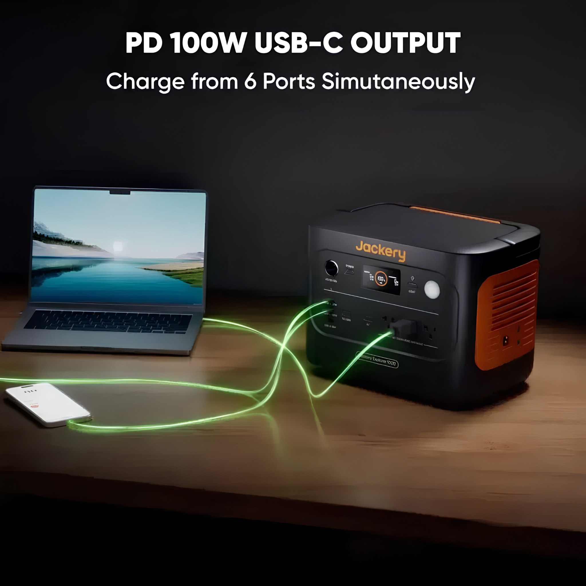 Jackery Explorer 1000 V2 Portable Power Station charging a laptop and smartphone at the same time with its 100W USB C and multiple output ports