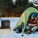 Jackery Extreme Guard Carrying Bag placed beside a camping tent in the snow, protecting a portable power station during outdoor use