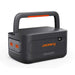 Jackery HomePower 2000 Plus v2 Battery Pack shown alone with a built-in handle, orange connection ports, and a small front power display