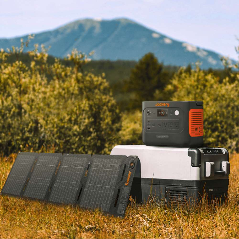 Jackery SolarSaga 40 Air Solar Panel is set beside a portable power station outdoors, ready to capture solar energy during camping