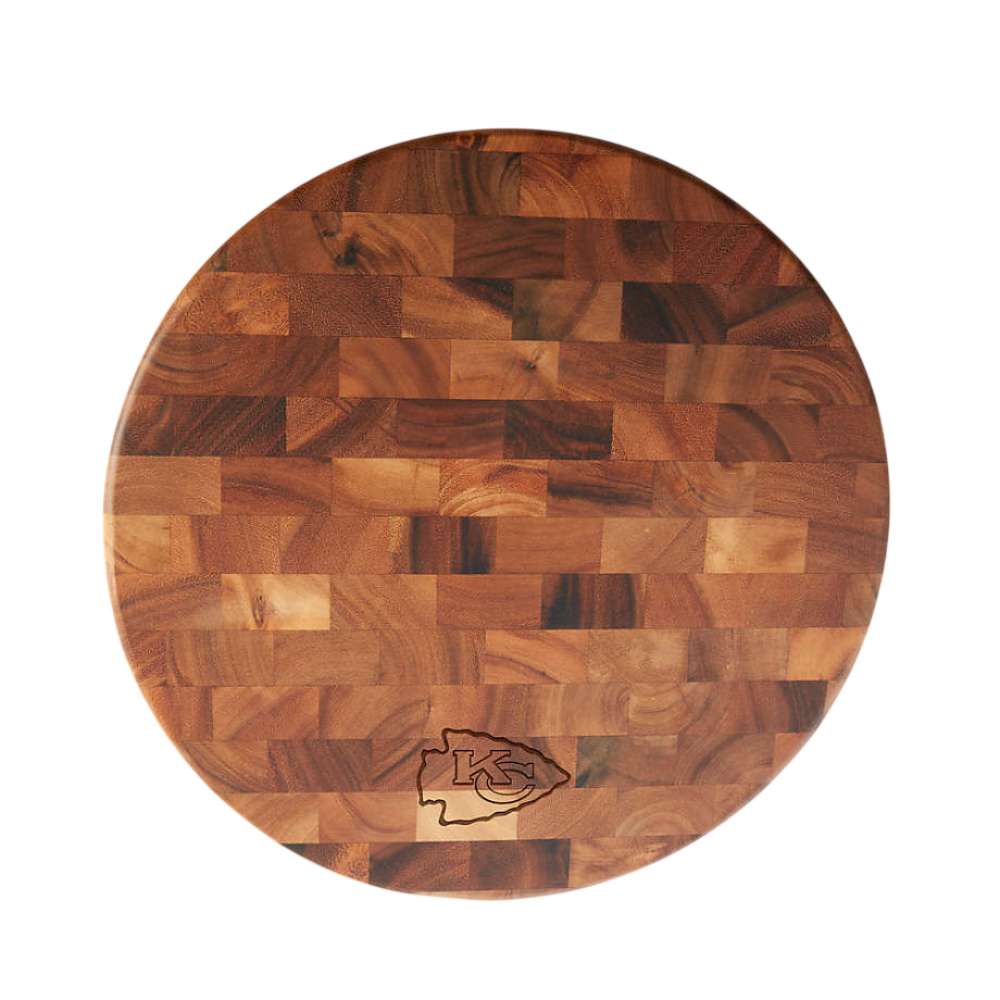 Kansas City Chiefs Crate & Barrel NFL Round End Grain Cutting Board features a round wood-block design with the Chiefs logo near the bottom