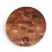 Las Vegas Raiders Crate & Barrel NFL Round End Grain Cutting Board features a round wood-block design with the Raiders shield logo near the bottom