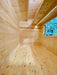 Long, narrow wooden interior of the Sawmill Structures The Lakeside Versa Cabana 67 Garden Room highlights its spacious floor and ceiling beams