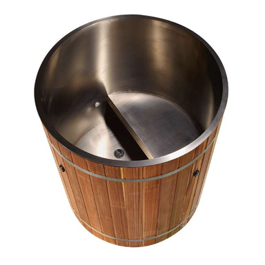 Looking down into Golden Designs Dynamic Cold Therapy Barrel 304 Stainless Steel Cold Plunge reveals a brushed stainless steel interior with a built-in seat