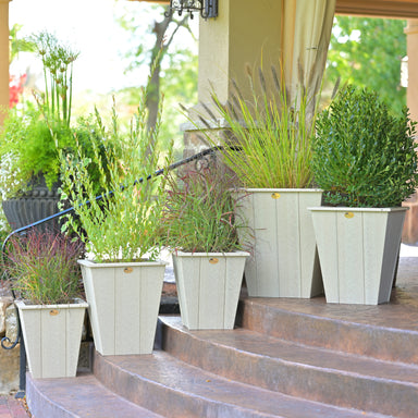 LuxCraft Elite Planters in sizes 18in, 22in, and 26in  placed on outdoor steps.