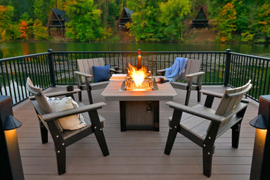 LuxCraft Hearthside Furniture Set forms an inviting gathering space on a deck with four Adirondack chairs surrounding a flickering fire pit