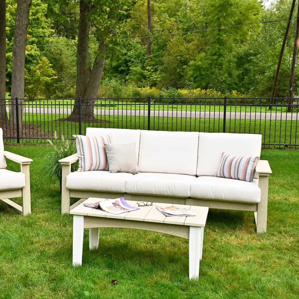 LuxCraft Lanai Deep Seating Sofa set in an outdoor space with light beige cushions