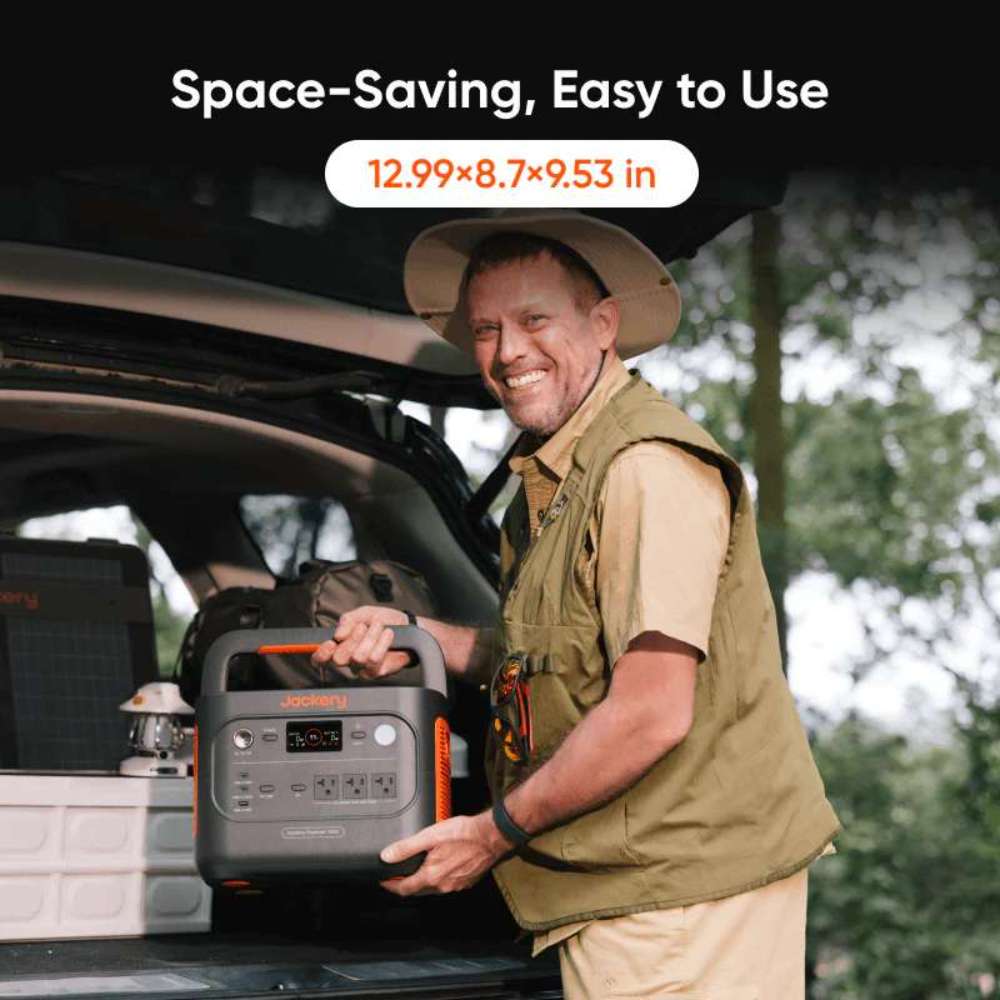 Man lifts Jackery Explorer 1500 v2 Portable Power Station from a car trunk, showing its compact size for outdoor travel