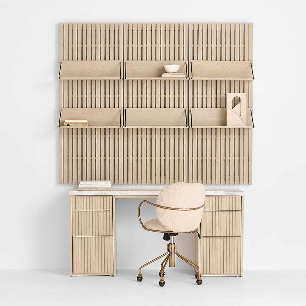 Modern home office featuring Crate & Barrel Luna Ivory Boucle Upholstered Office Chair paired with a wood desk and wall shelving