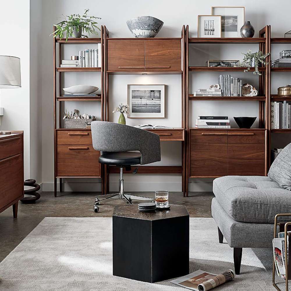 Modern home office setup featuring Crate & Barrel Tate Walnut Bookcase Desk with Outlet within a modular walnut storage collection