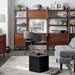 Modern home office setup featuring Crate & Barrel Tate Walnut Bookcase Desk with Outlet within a modular walnut storage collection