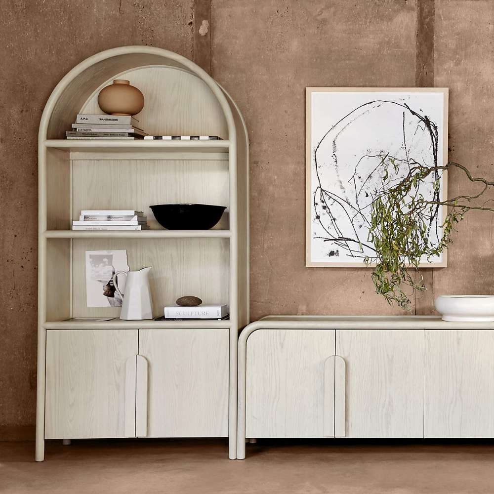 Modern living room featuring Crate & Barrel Annie 38" Whitewashed Wood Storage Bookcase with Shelves beside a matching cabinet