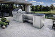 Modern patio view of the Sunstone Summit 10ft Outdoor Kitchen Island Package with grill, sink, and storage beside a peaceful lake