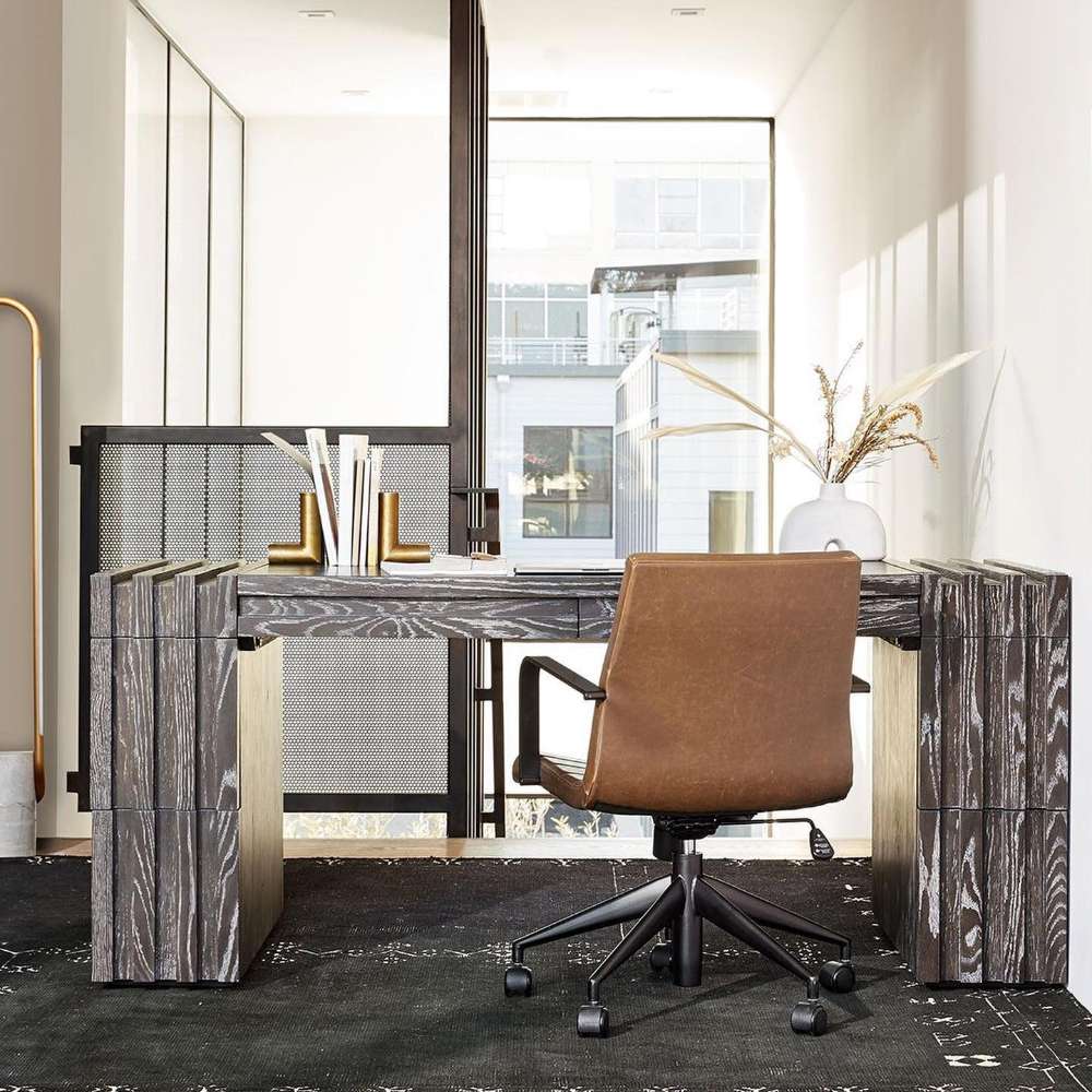 Modern wood desk paired with Crate & Barrel Graham Brown Office Chair in a bright contemporary office