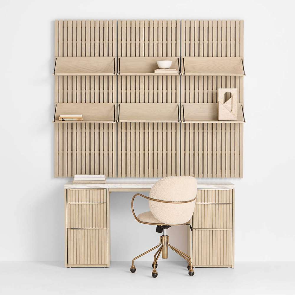 Modern workspace with Crate & Barrel Batten 62" White Oak Wood Desk with White Marble Top and Panel Set with 6 Reversible Shelves, paired with a rolling desk chair