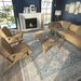 Modern living room setup highlights Momeni Anatolia Indoor Rug - ANA-8 Blue, tying together the neutral furniture with its elegant colors