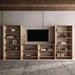 Modular living room wall uses Crate & Barrel Terrazza 38" Natural Solid Oak Wood 5-Shelf Storage Bookshelf on both sides of a mounted TV with open shelving