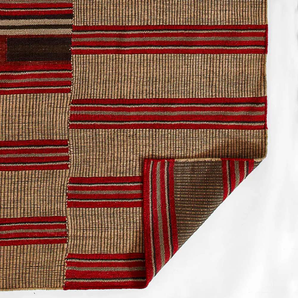Momeni Adobe Indoor Rug - ADO-1 Red is shown with its corner folded