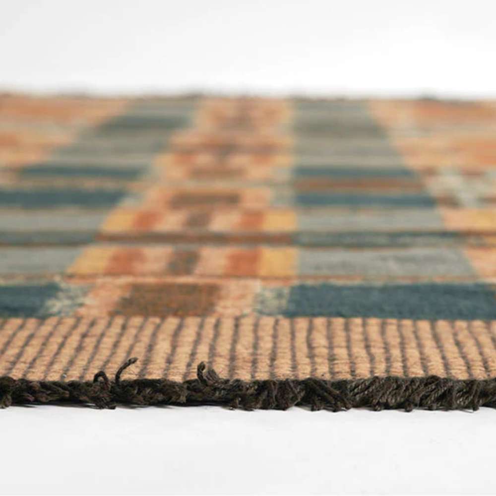 Momeni Adobe Indoor Rug - ADO-3 Blue lies flat on the floor showing its low pile and neat fringed edge