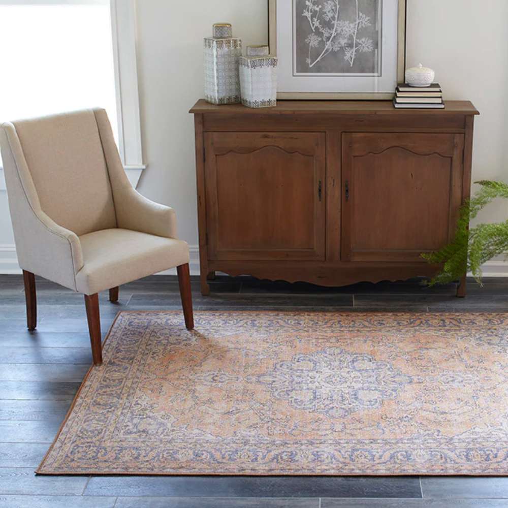 Momeni Afshar Indoor Rug - AFS11 Copper lies beautifully in a cozy living room setup
