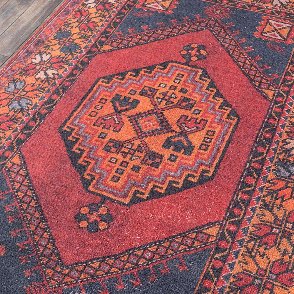 Momeni Afshar Indoor Rug - AFS16 Red features a bold central medallion with intricate geometric patterns in deep red, orange, and navy tones