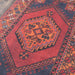 Momeni Afshar Indoor Rug - AFS16 Red features a bold central medallion with intricate geometric patterns in deep red, orange, and navy tones