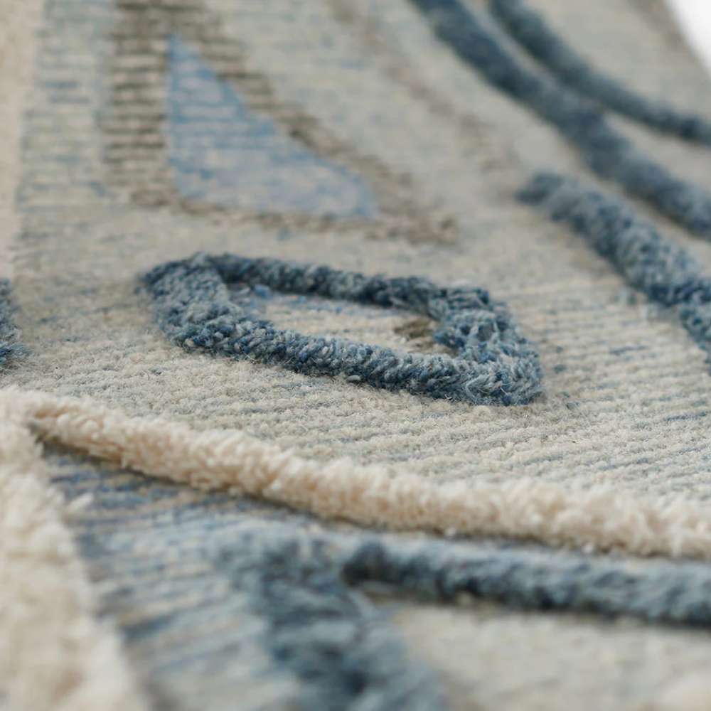 Momeni Allegro Indoor Rug - ALL-1 Blue features raised tufting that enhances its geometric shapes