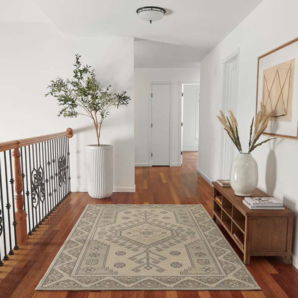 Momeni Anatolia Indoor Rug - ANA-11 Sage is styled in a bright hallway, complementing wood floors and modern décor