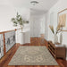Momeni Anatolia Indoor Rug - ANA-11 Sage is styled in a bright hallway, complementing wood floors and modern décor