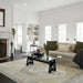 Momeni Anatolia Indoor Rug - ANA-2 Light Blue completing a bright living room setup with a sofa and glass coffee table
