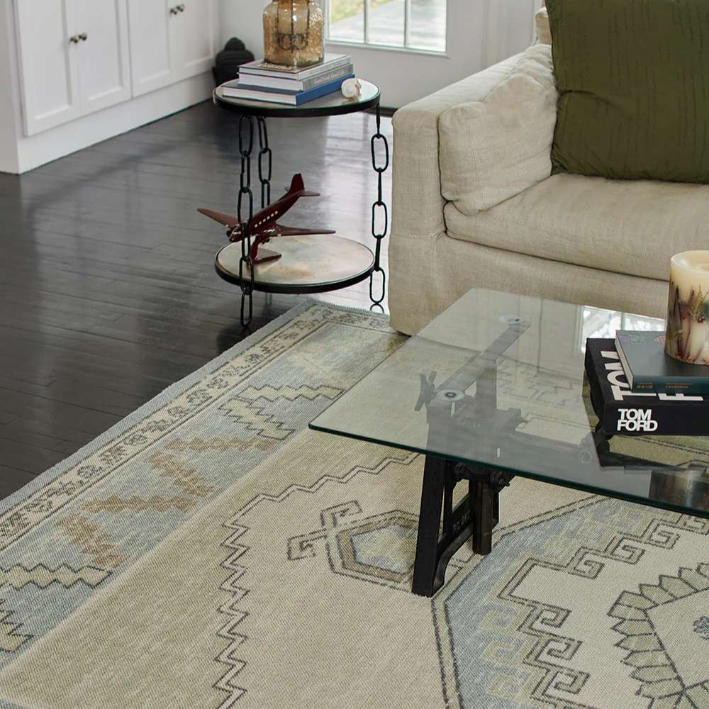 Momeni Anatolia Indoor Rug - ANA-2 Light Blue styled in a living room with a sofa and glass coffee table