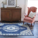 Momeni Anatolia Indoor Rug - ANA-3 Navy enhances a cozy living space with its bold blue medallion design under a classic pink armchair