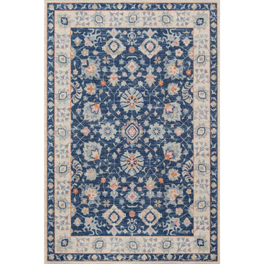 Momeni Anatolia Indoor Rug - ANA-8 Navy is a rectangular area rug with an ornate floral pattern framed by a light border