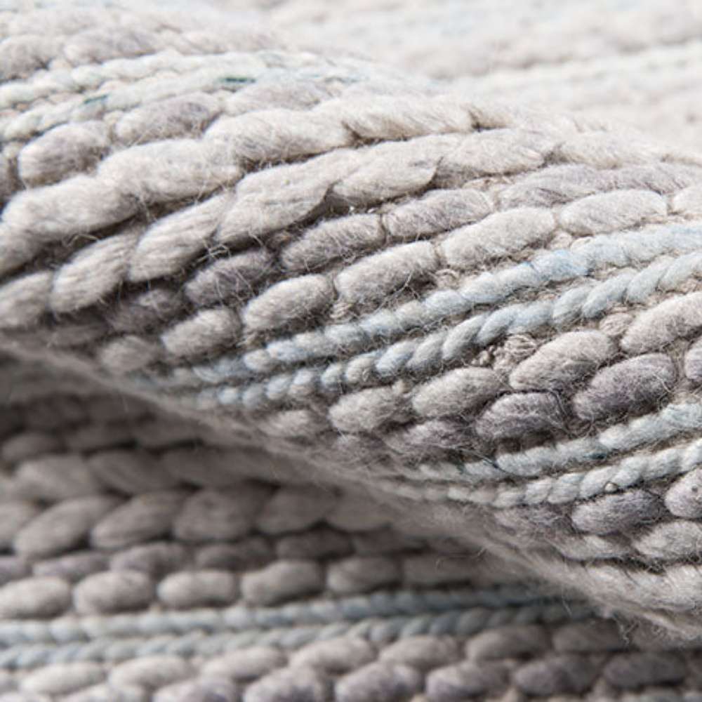 Momeni Andes Indoor Rug - AND-4 Light Grey features thick, handwoven wool loops that add comfort and texture underfoot