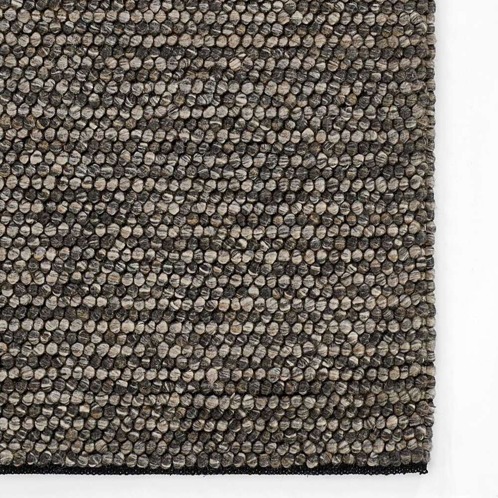 Momeni Andes Indoor Rug - AND-8 Charcoal highlights a detailed corner view with a uniform pebble-textured weave