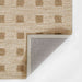 Momeni Archer Indoor Rug - ARC-1 Beige showcases its corner fold with a durable backing
