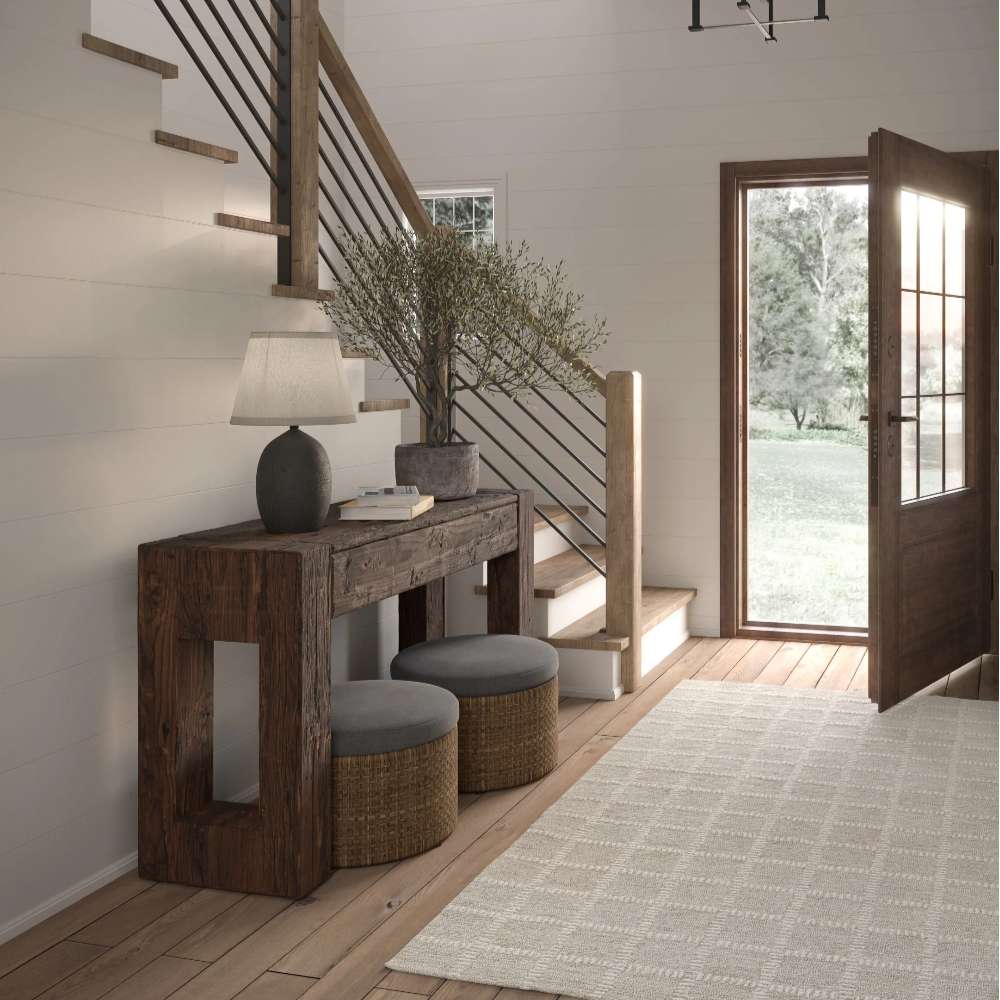 Momeni Archer Indoor Rug - ARC-3 Beige adds warmth and texture to a rustic entryway with wooden floors and natural light