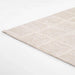Momeni Archer Indoor Rug - ARC-3 Beige lies flat on the floor showcasing its smooth, low-pile surface
