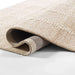 Momeni Archer Indoor Rug - ARC-3 Beige rolls smoothly, showing flexibility and strength in its premium weave