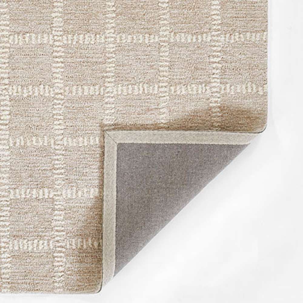 Momeni Archer Indoor Rug - ARC-3 Beige shows its durable backing and neatly stitched edges