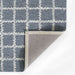 Momeni Archer Indoor Rug - ARC-3 Blue is shown from the corner, highlighting its sturdy backing and neat edge finish